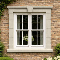 Alnwick 16 Windowsill Paint colour inspiration on an exterior window surround against yellow brick with a soft Portland cream finish and gentle beige warmth