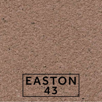 Easton 43 textured stone effect paint close-up showing a rich muted stone finish with purple brown undertones