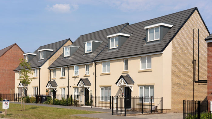 Modern detached houses featuring windowsills and headers painted with Stonelux® stone effect paint, demonstrating realistic stone finishes in residential construction.