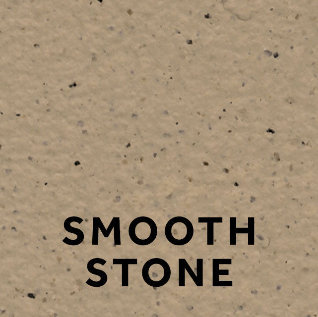 Marney 31 Smooth Stone stone effect paint close-up showing a warm sandy beige finish with gentle grey brown depth and dark mineral flecking