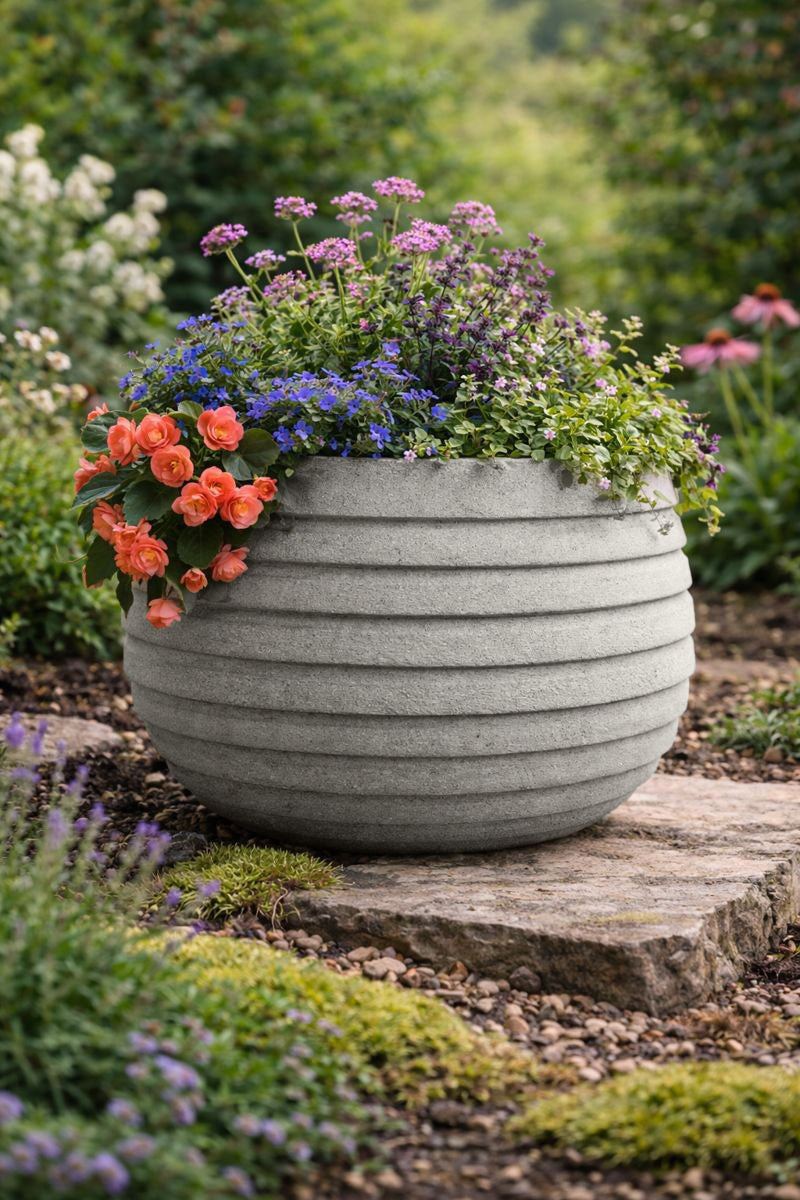 Grey 50 Garden Paint applied to an outdoor planter with a warm grey natural stone finish