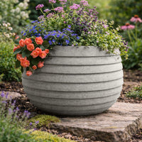 Grey 50 Garden Paint applied to an outdoor planter with a warm grey natural stone finish