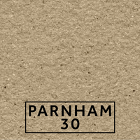 Parnham 30 textured stone effect paint close-up showing a warm buff beige finish with soft grey brown variation and dark mineral flecking