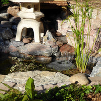 Rockingham 58 stone effect paint applied to a garden water feature ornament with a light warm limestone finish and gentle cream-beige warmth