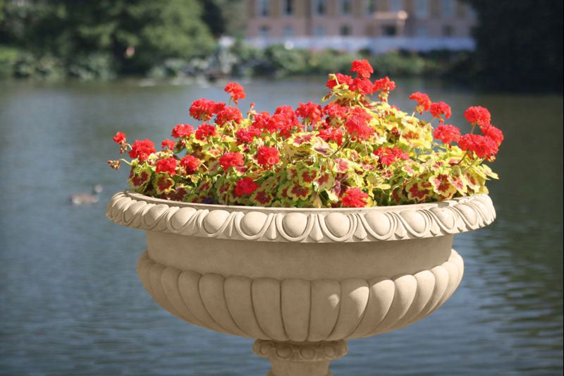 Hever 15 Garden Paint applied to an ornate outdoor planter with a warm earthy buff stone effect finish