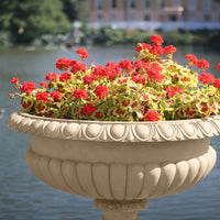 Hever 15 Garden Paint applied to an ornate outdoor planter with a warm earthy buff stone effect finish