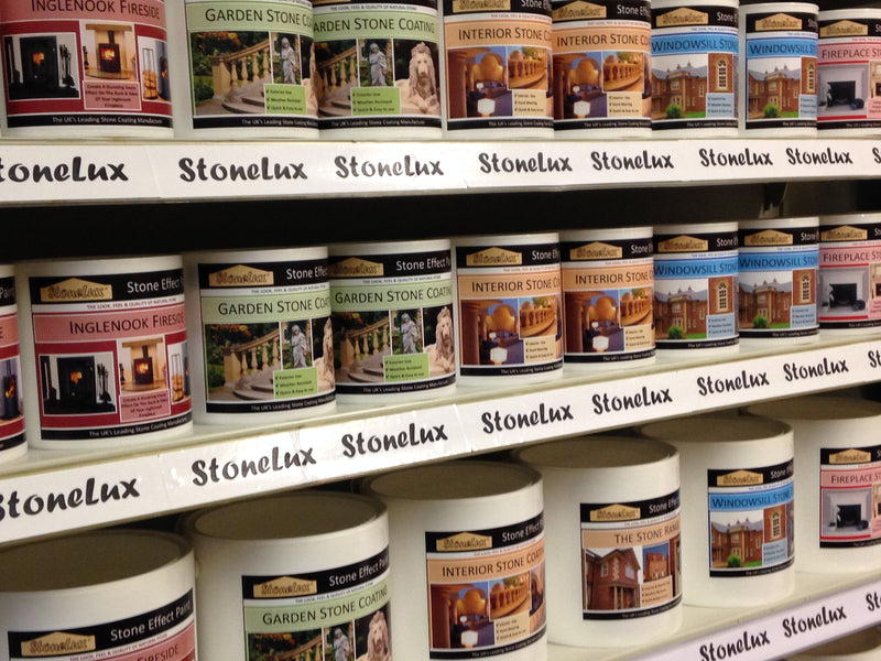Shelves stocked with Stonelux old branded paint or stain cans for stone masonry, including Garden Stone, Garden Stone Coach, Interior Stone, Fireplace, and Window & Door varieties.