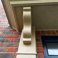 Close up of Buff 04 stone effect paint applied to an exterior door surround with a warm creamy beige Yorkstone finish