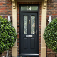 Buff 04 stone effect paint applied to an exterior door surround with a warm creamy beige Yorkstone finish