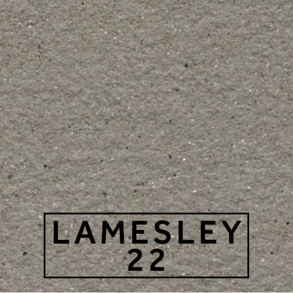 Lamesley 22 textured stone effect paint close-up showing a soft warm grey finish with subtle beige undertones and mineral flecking