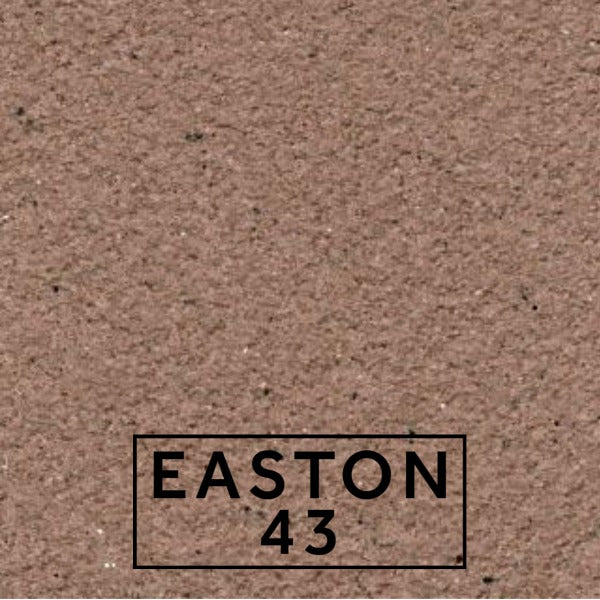 Easton 43 textured stone effect paint close-up showing a rich muted stone finish with purple brown undertones